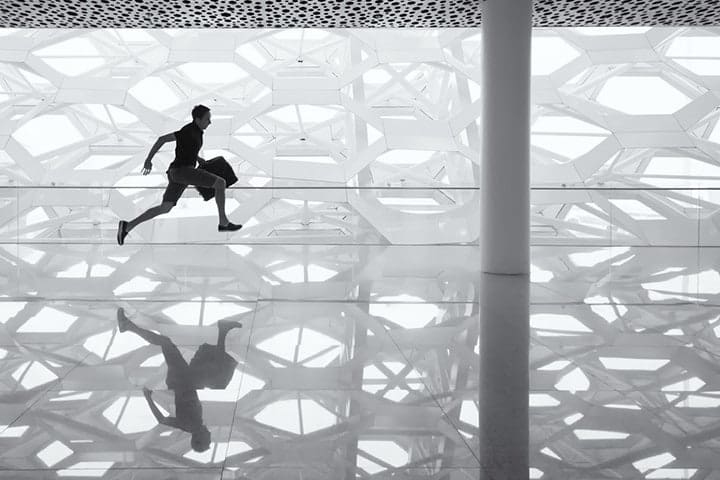 a man running with his luggage