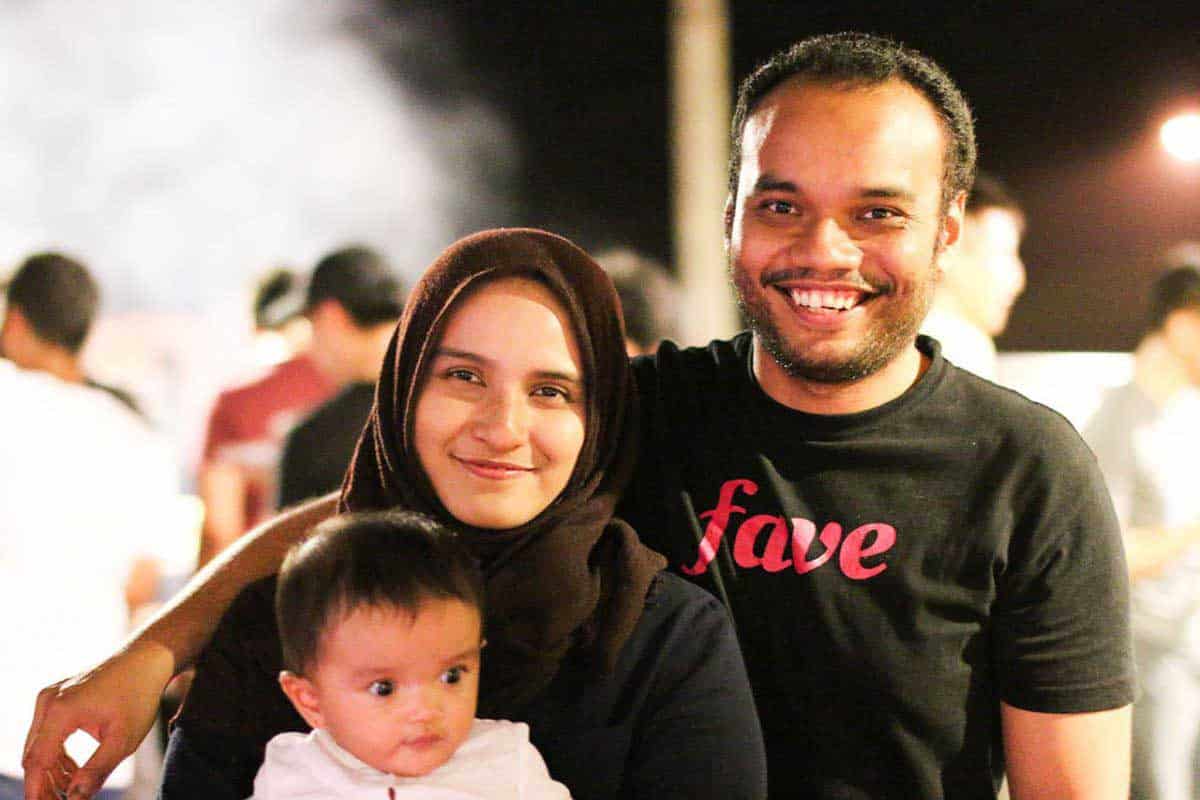 Rizal Muthi, software developer in Envato and previously NEXT Academy's mentor, together with his wife and daughter